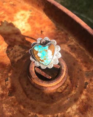 Get your hands on this Stunning Vintage Ring.  Gorgeous * very rare * vintage #8 Mine Turquoise carved into a 3/4" Southwest ring. 22mm polished heart cabochon set in handmade sterling silver rose petal setting with 18K Rose Gold accent!  Top Notch. One of a kind collectors item to be worn, admired and treasured.  Size 7.5 AUO (Medium) see our ring guide.