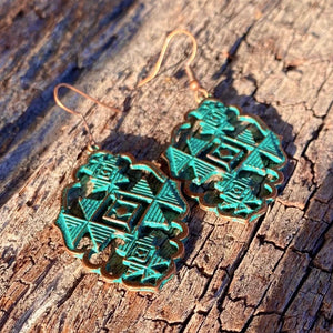 Sexy Southwest Earrings  These have always been an best seller. Stunning chevron ‘cutout design’ with teal~blue patina on copper accent.  New Mexico. Copper hardware. Statement size 6.2cm x 6.9cm. The cutout does makes them lighter weight to wear comfortably.