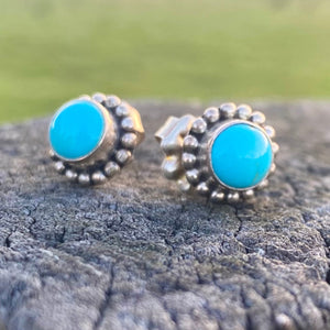 Southwest Beauties!  Sleeping Beauty Turquoise from Globe, Arizona. AAA Grade American Turquoise in natural bright blue!  Elegant 1/2" in length, in .925 sterling silver with Southwest style settings. Stone size 7mm, overall earring length with hand crafted posts studs.