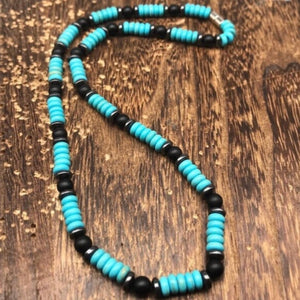 Unisex Southwestern Necklace   Polished Turquoise heishi beads with hematite and blank Onxy beads. Full length length 22” inches. 