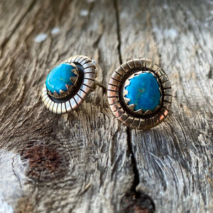 Southwest Stunners!  Bright blue Morenci Turquoise stones from Nevada .65" in overall length.  Natural setting with Southwest detail. Artisan made in New Mexico in sterling silver. Stud post with butterfly clasps. Measures 10x8mm.   These rare earrings are made to be comfortably worn, treasured and admired.