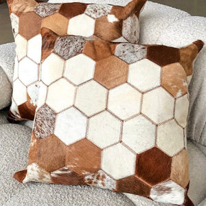 On Trend Textile, be the envy of your friends with this gorgeous throw cushion.  Front of cushion features cowhide ‘honeycomb patchwork’ design with dark brown leatherette backing. Stuffed cushion.  Each cushion is unique. Nice big 46cm x 46cm.